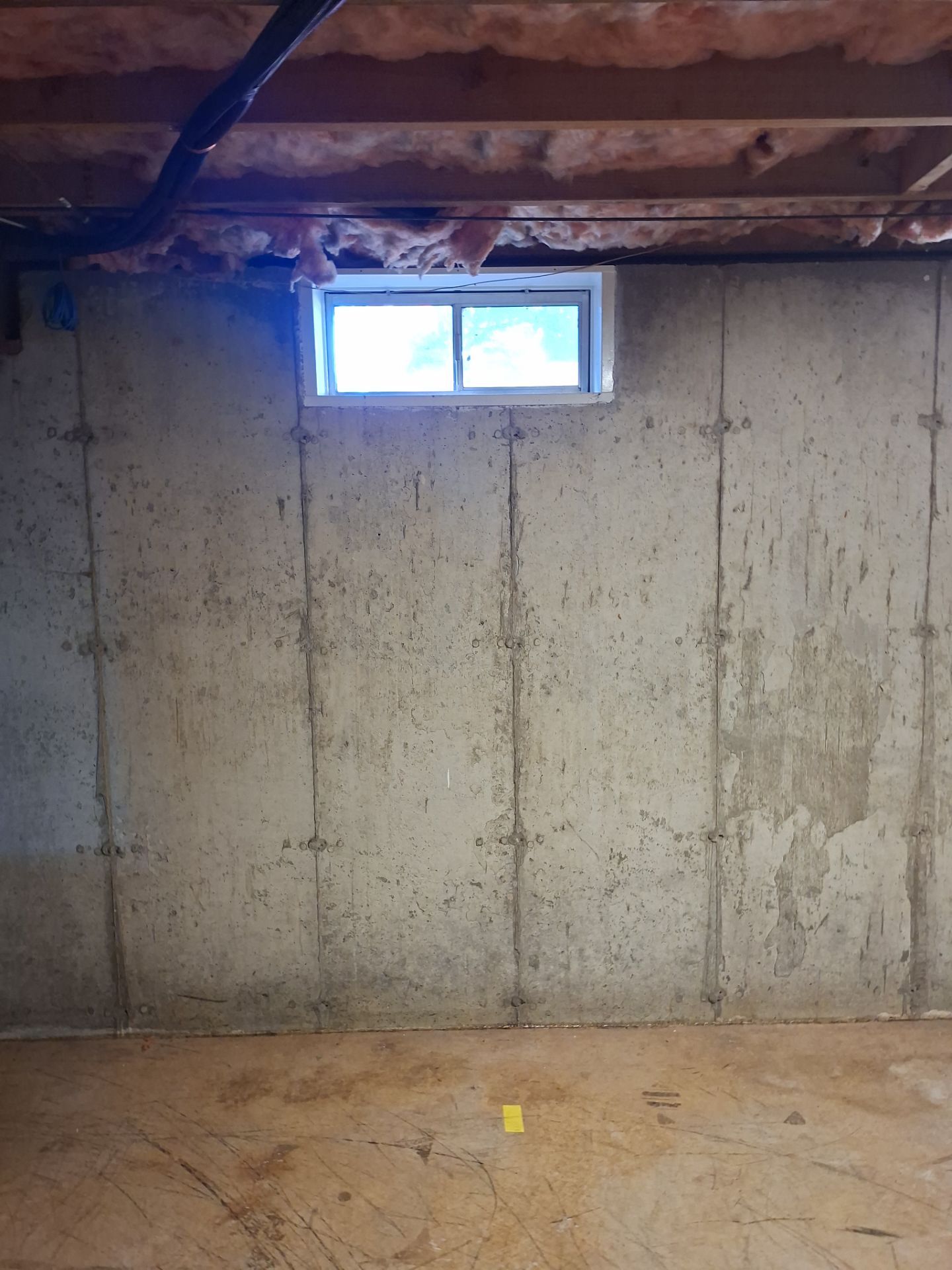 Before egress window installation in Bristol, Connecticut — interior view