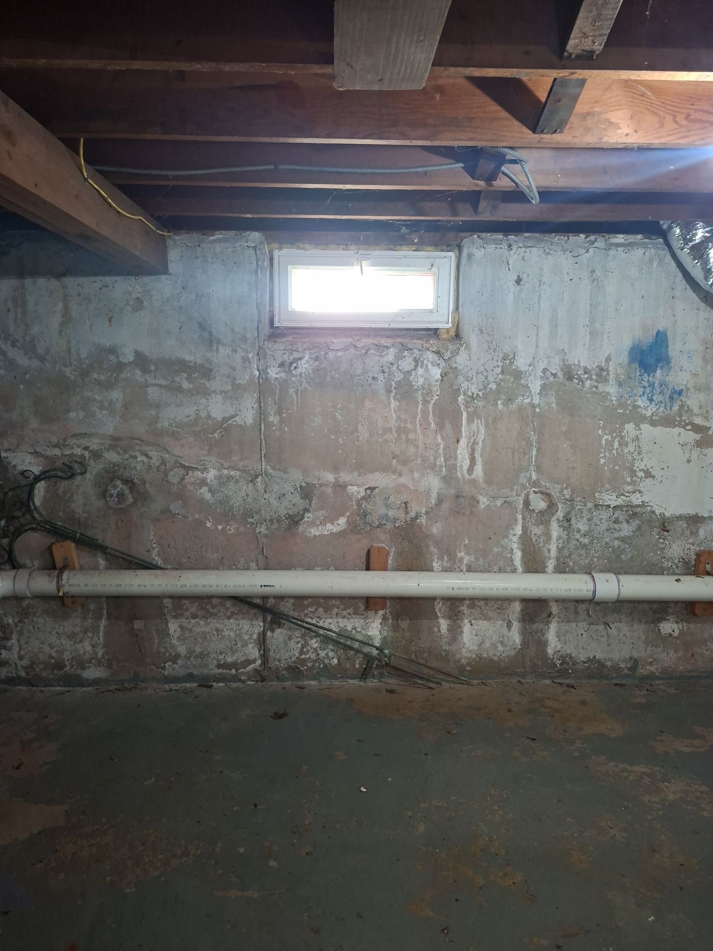 Before egress window installation in East Haven, Connecticut — interior view