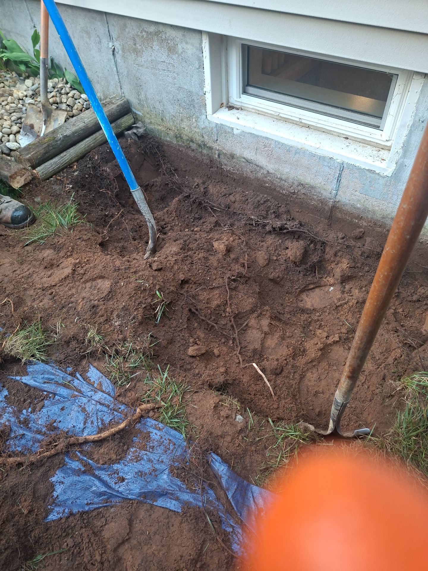 Before egress window installation in Glastonbury, Connecticut — exterior view