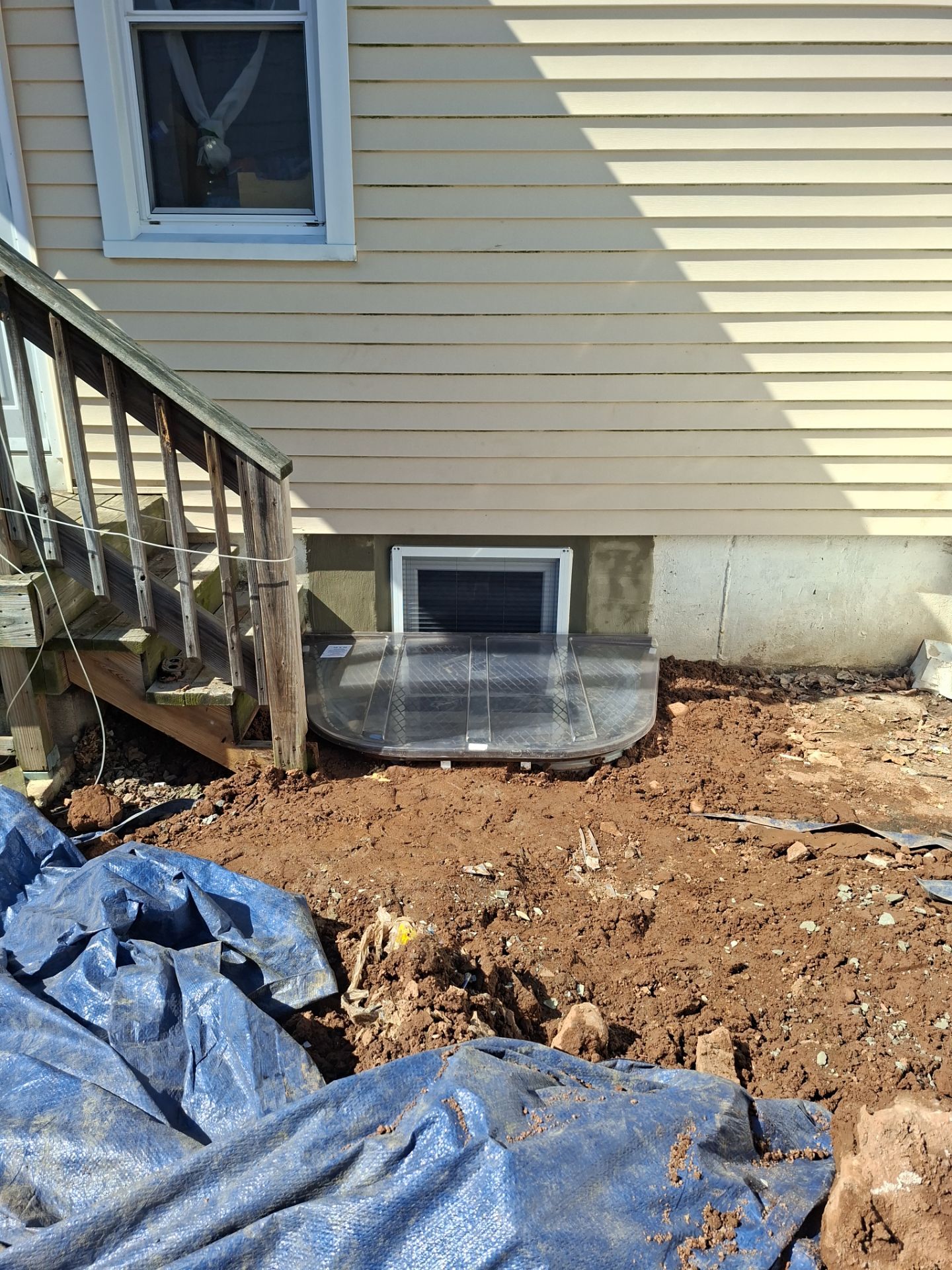 After egress window installation in East Haven, Connecticut — exterior view