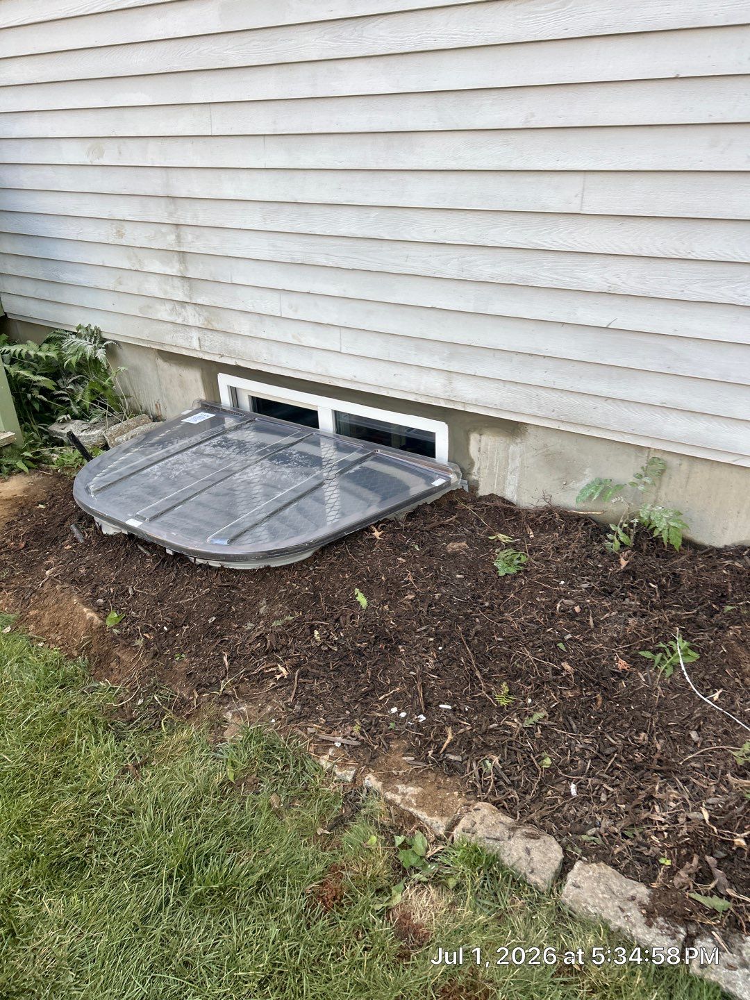 After egress window installation in Fairfield, Connecticut — exterior view