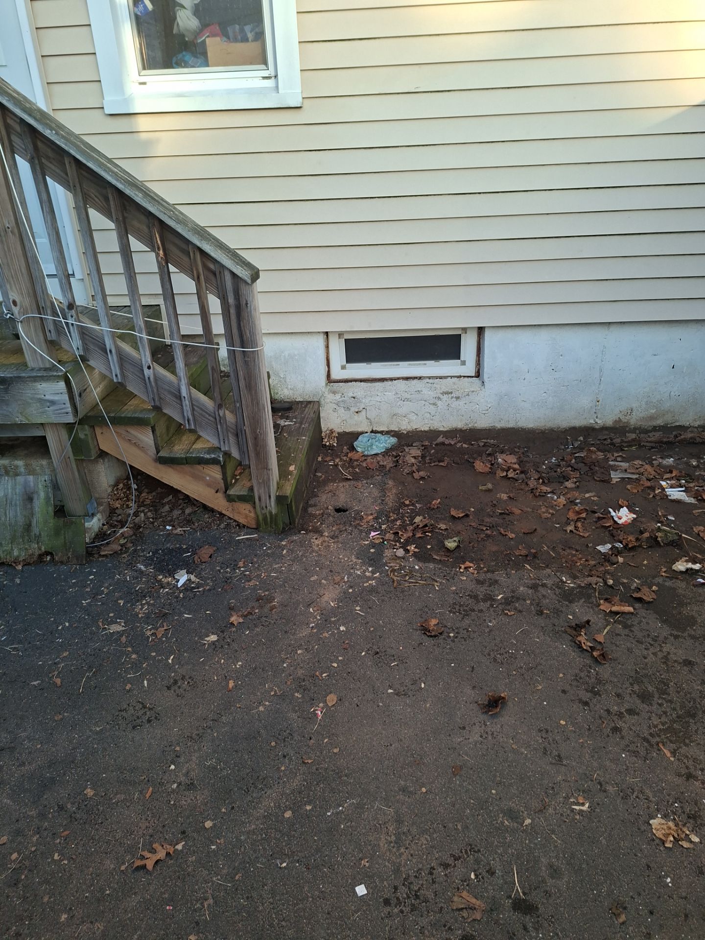 Before egress window installation in East Haven, Connecticut — exterior view