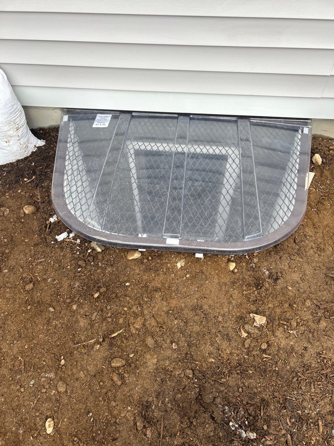 After egress window installation in Madison, Connecticut — exterior view