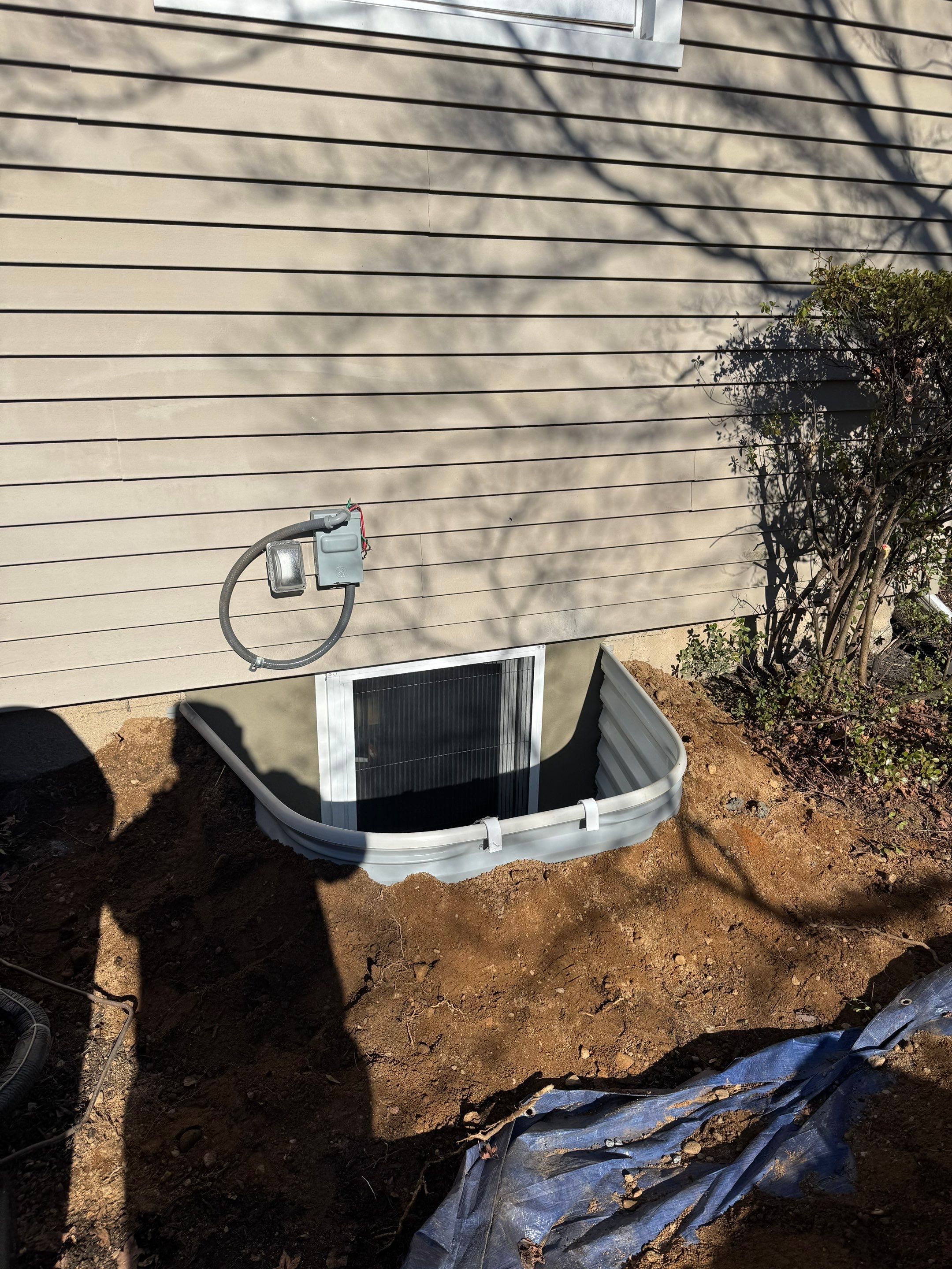 After egress window installation in Milford, Connecticut — exterior view
