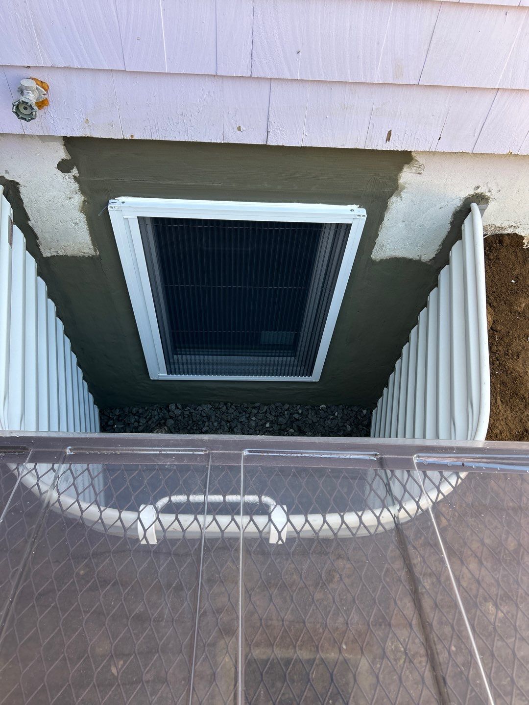After egress window installation in Lebanon, Connecticut — exterior view