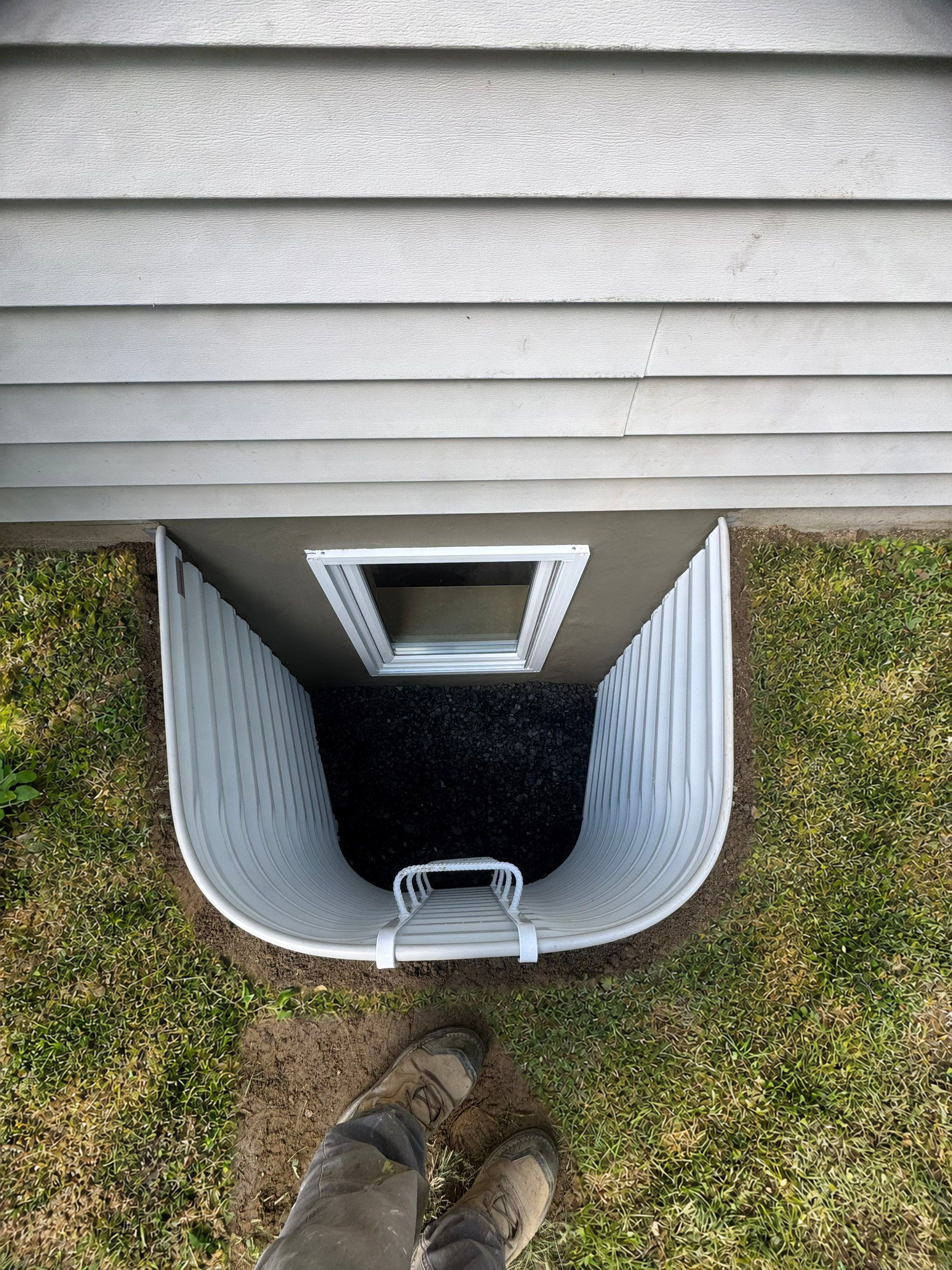 After egress window installation in Winchester, Connecticut — exterior view