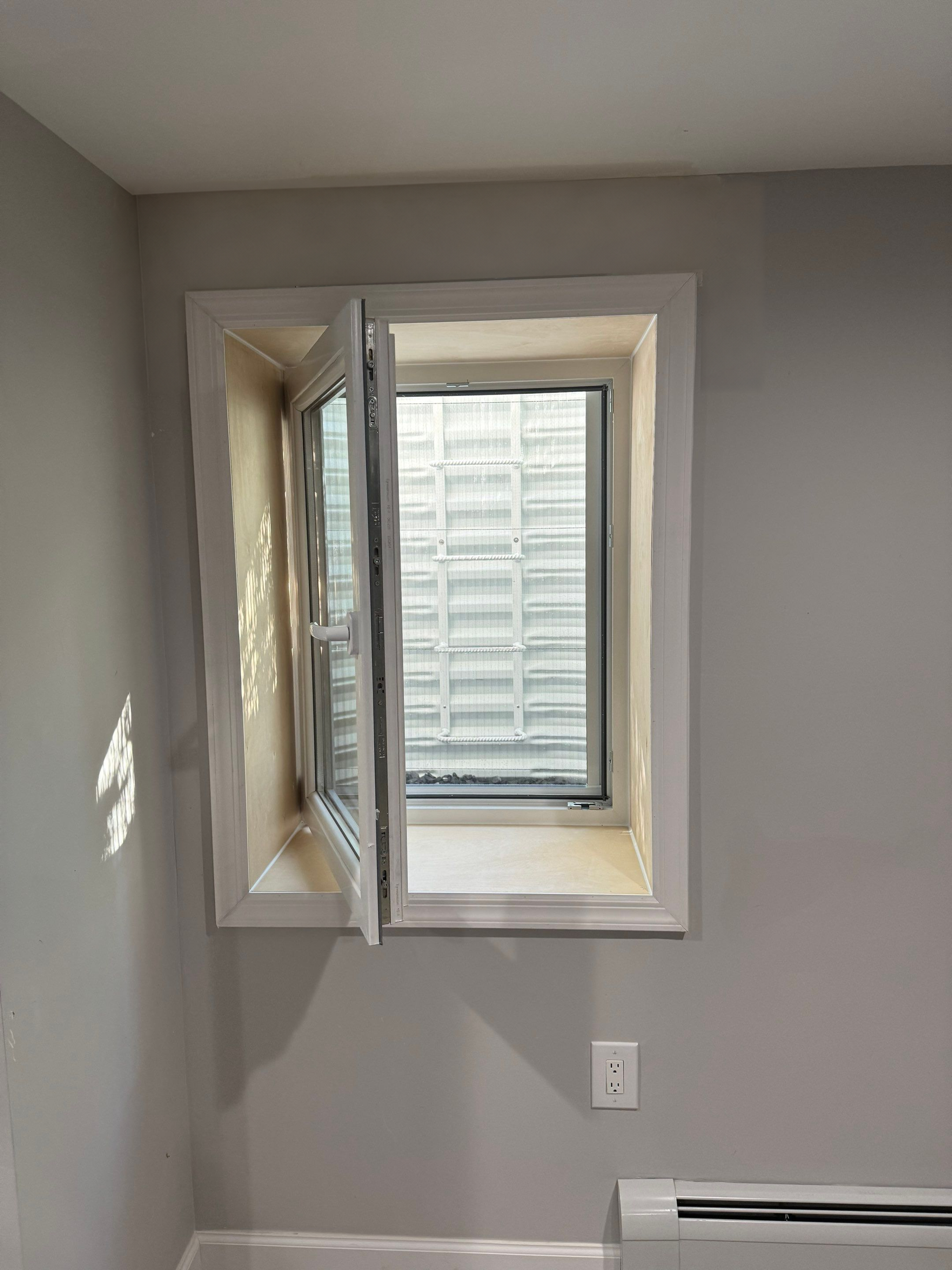 Inward-opening egress window at a Winchester, Connecticut home